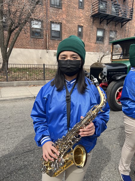 Saxophone player ready for the start of the parade.